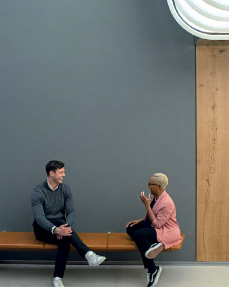 a man and woman talking to each other