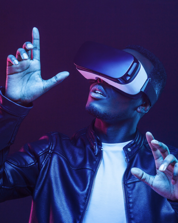 A man in leather jacket wearing a VR set