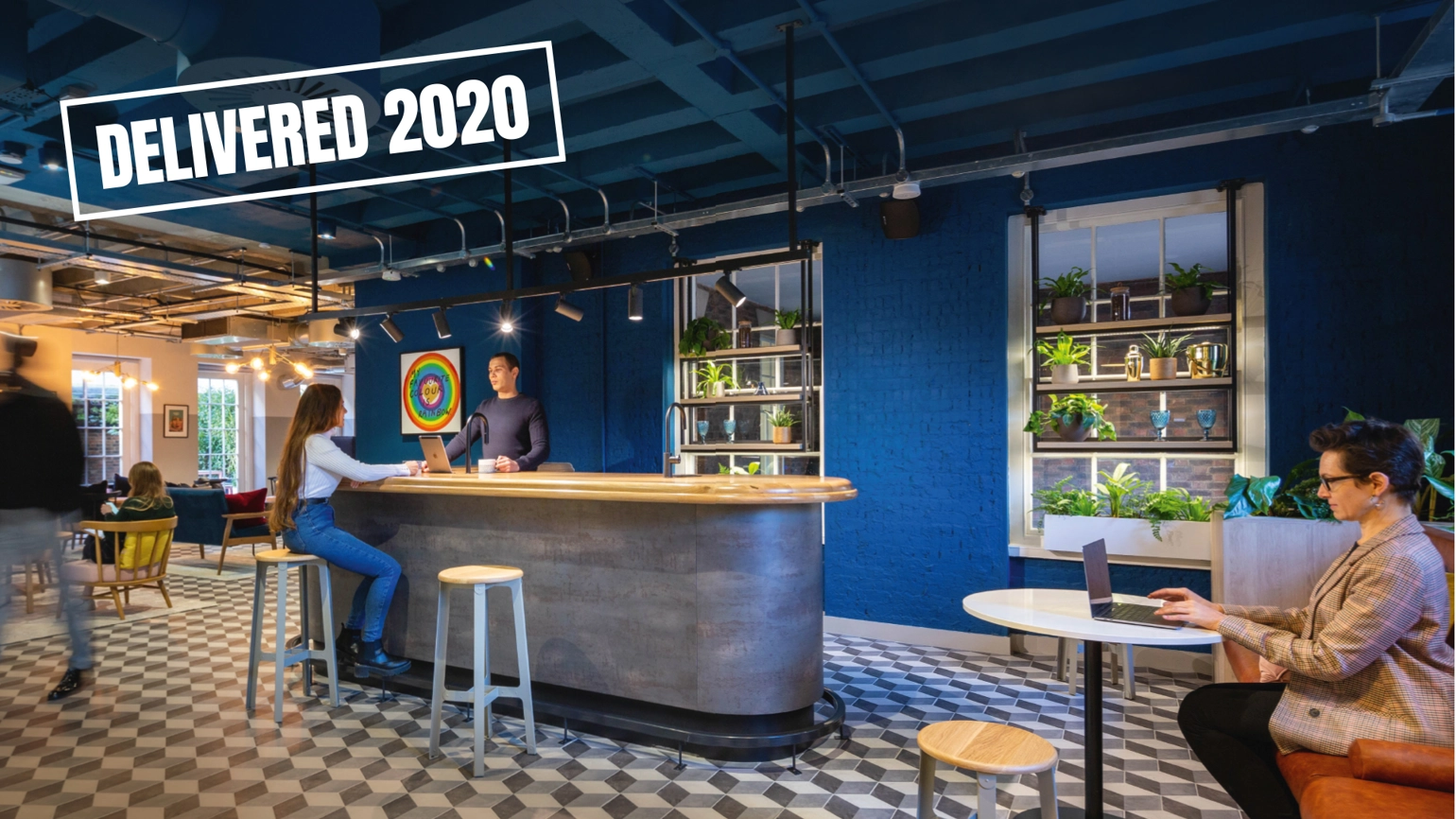 A coffee shop with people working inside