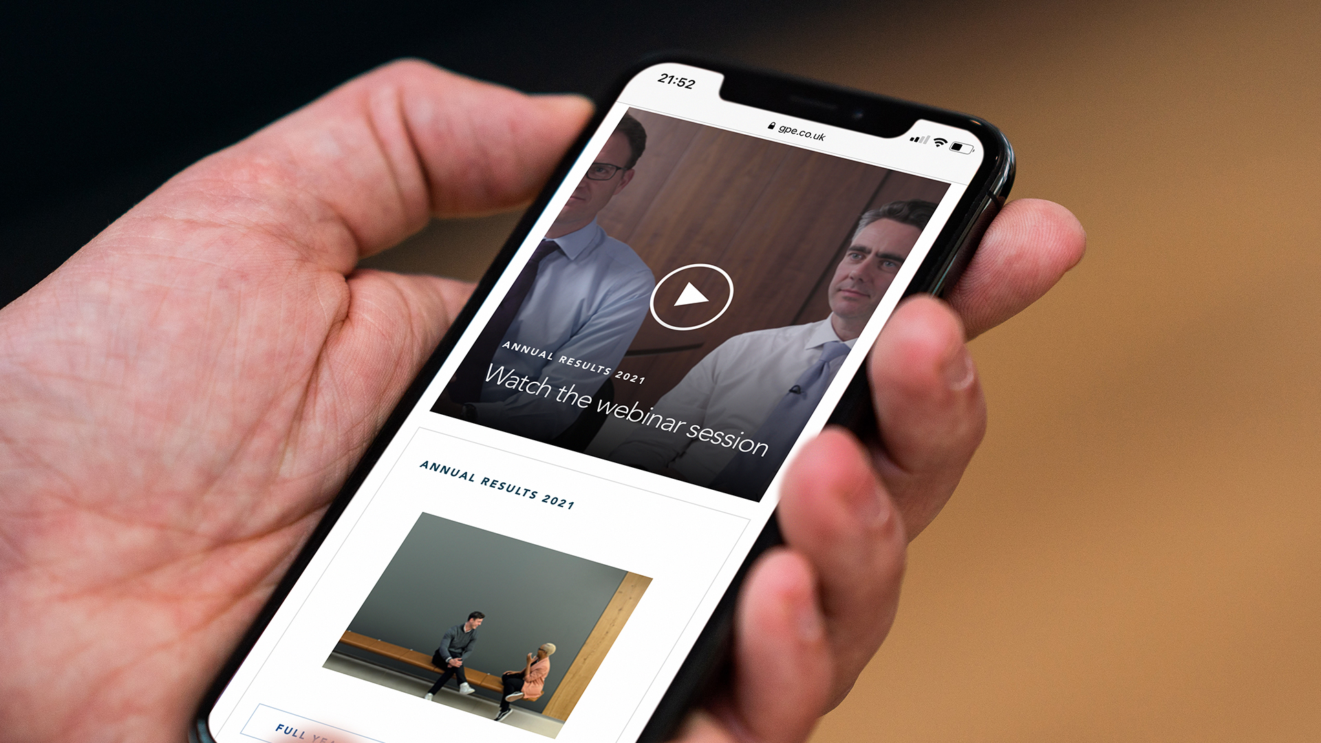 A hand browsing a website on a phone 