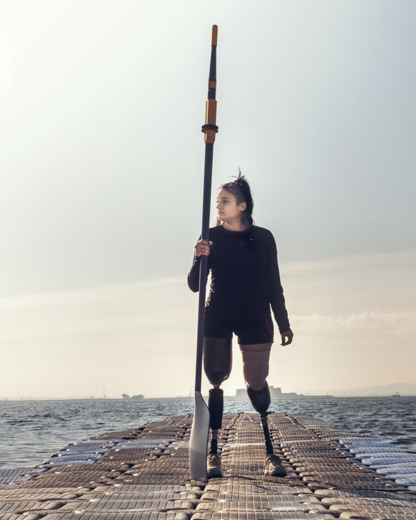 A disabled girl is doing sea kayak to demonstrate Allianz's social inclusion