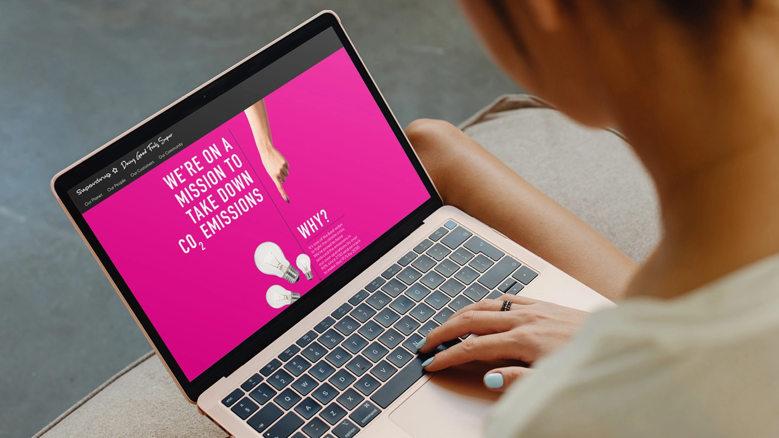 Image that shows campaign creative on a laptop screen with the words we're on a mission to take down co2 emissions